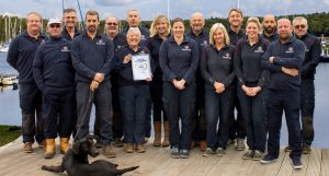 Buckler's Hard Yacht Harbour team with winner certificate