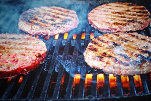 BBQ with burgers cooking