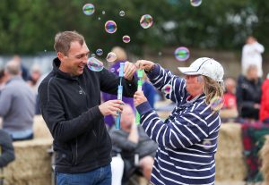 Two mooring holders blowing bubbles