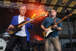 John Illsley and his band performing on stage