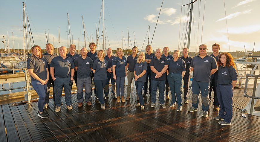 The Beaulieu River staff members stood on the marina for a team photo