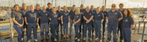 The Beaulieu River staff members stood on the marina for a team photo