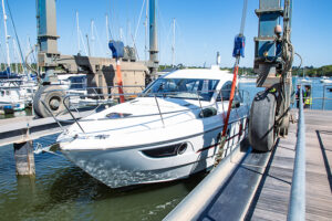 A boat being lifted to the boatyard using the boat hoist